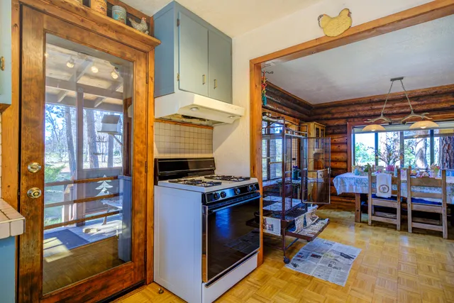 a living room with furniture a rug and a large window