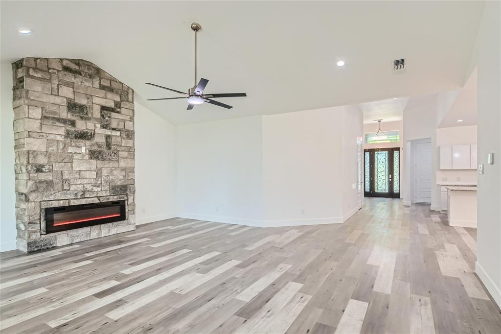 2940 Henry Road Lancaster, TX 75134 - Photo 5 of 10 a view of an empty room with a fireplace