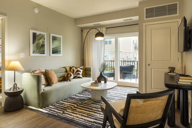 a living room with furniture and a window