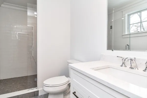 a bathroom with a sink toilet and vanity