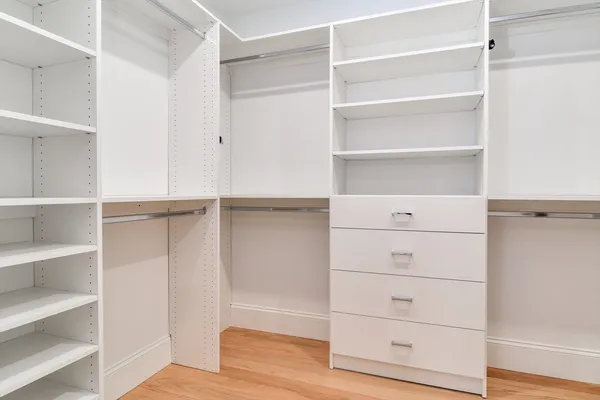 a view of an empty walk in closet