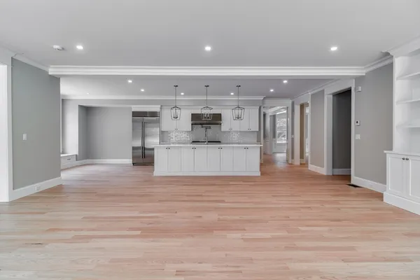 a view of a kitchen with a sink and microwave