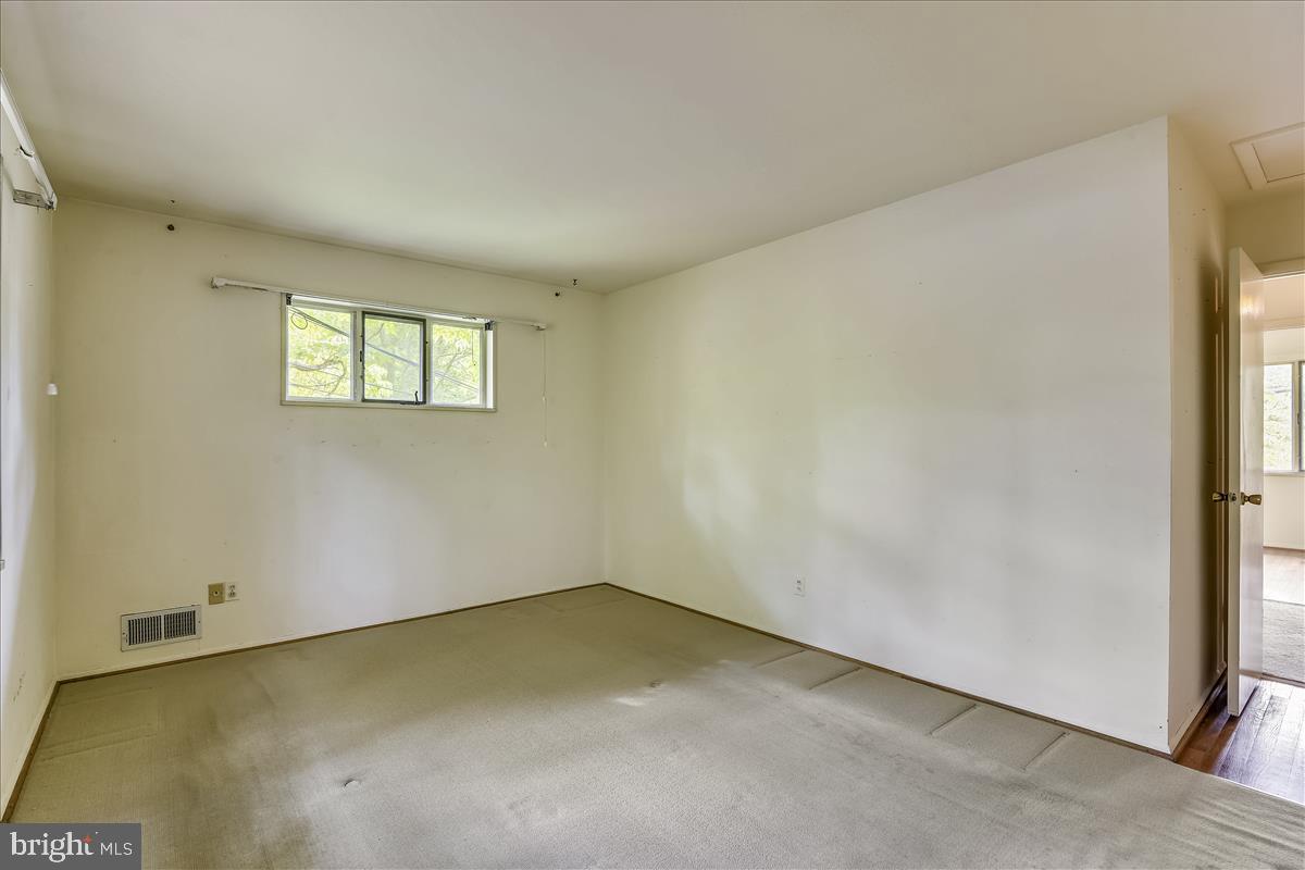 3538 Cornell Road Fairfax, VA 22030 - Photo 33 of 61 Master bedroom with hardwood underneath carpet
