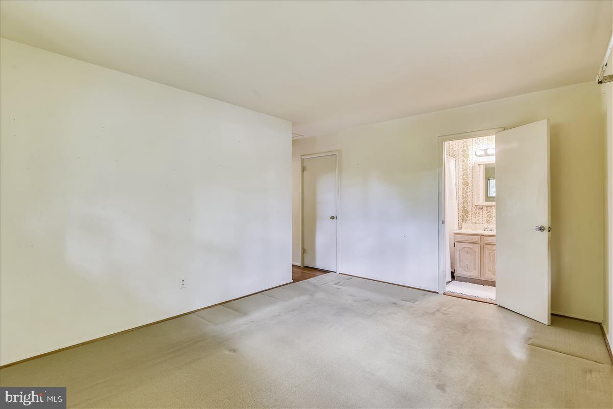 3538 Cornell Road Fairfax, VA 22030 - Photo 34 of 61 Master bedroom with hardwood underneath carpet