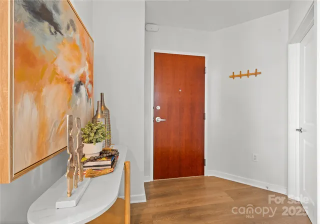 a view of a livingroom with furniture and wooden floor
