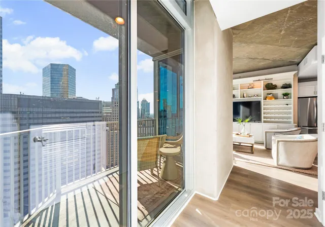 a view of a living room and kitchen with furniture