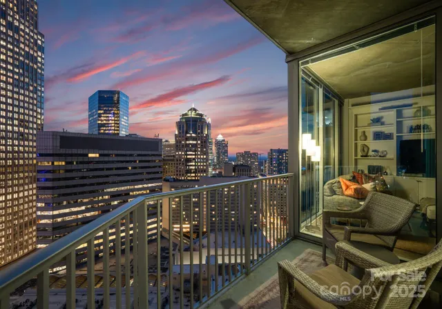 a view of a balcony with city view