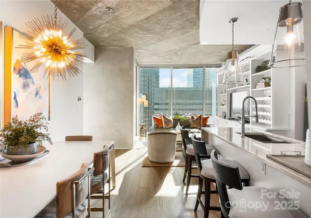 a dining room with furniture and chandelier