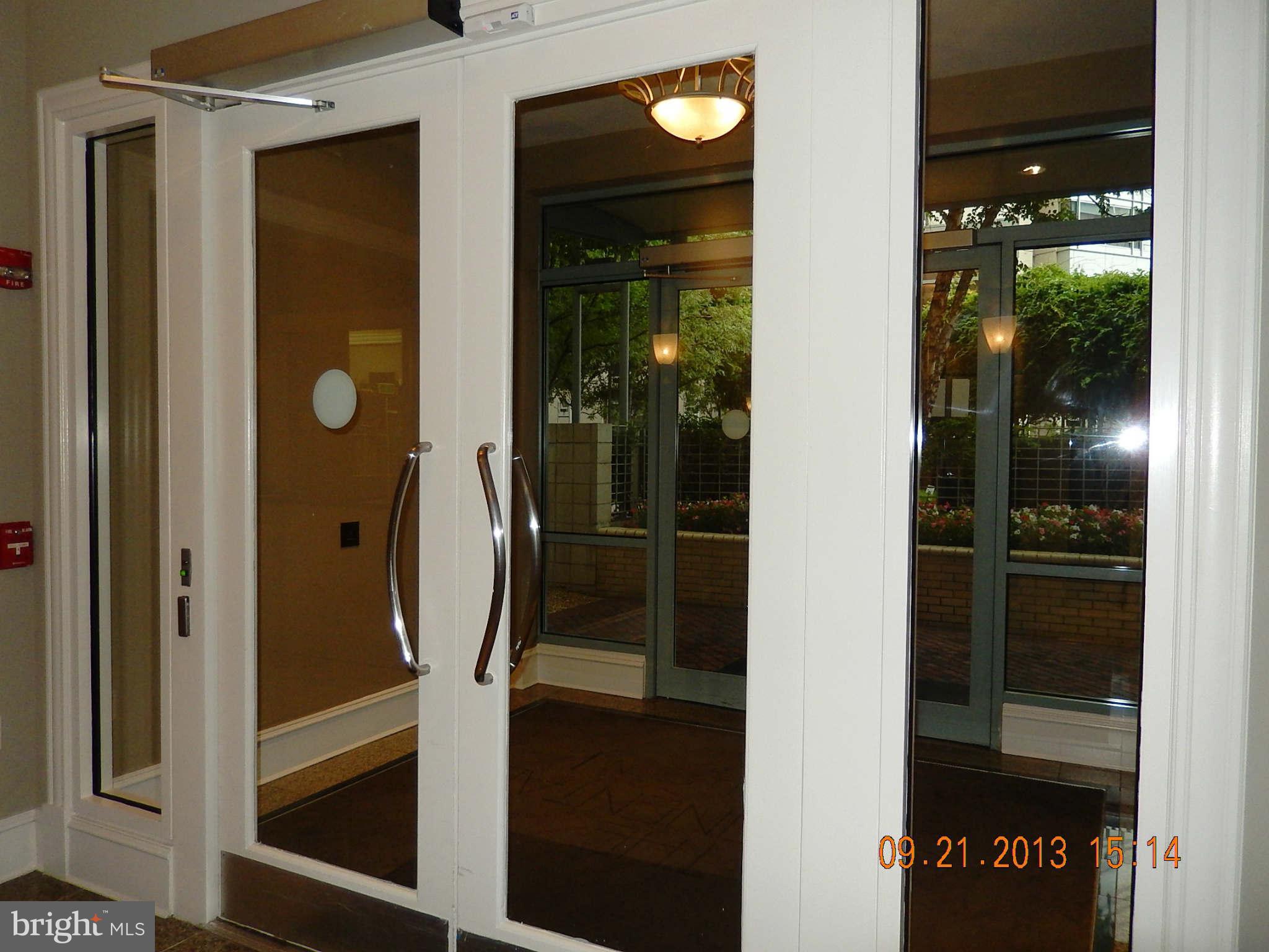 851 North Glebe Road, Unit 1018 Arlington, VA 22203 - Photo 20 of 24 a bathroom with a glass shower door and a mirror