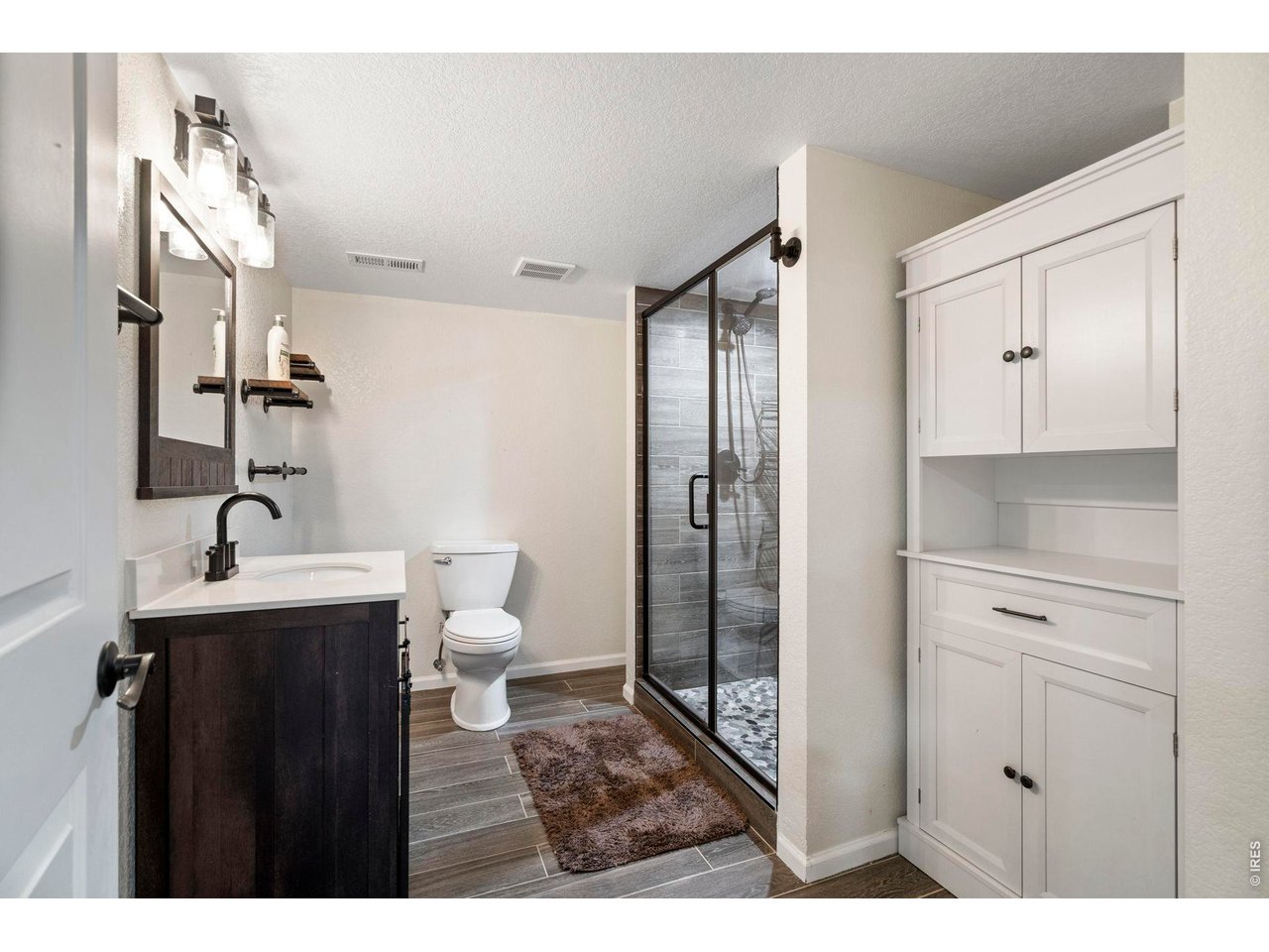 10080 Cedar Street Firestone, CO 80504 - Photo 31 of 38 Big, Basement bath with oversized shower and plenty of storage