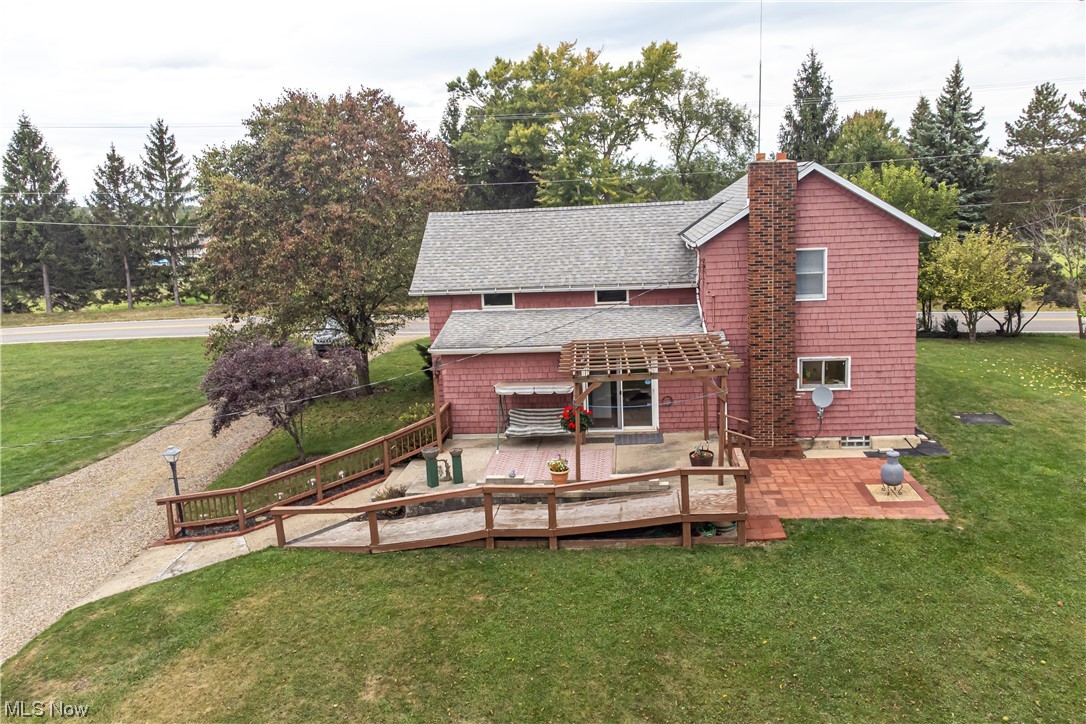 3946 Poe Road Medina, OH 44256 - Photo 26 of 35 Back of house with a lawn and a deck