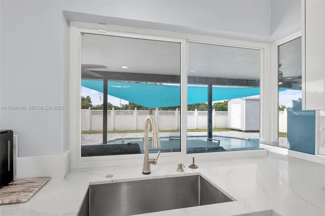 a view of a room that has a couch and a table in it