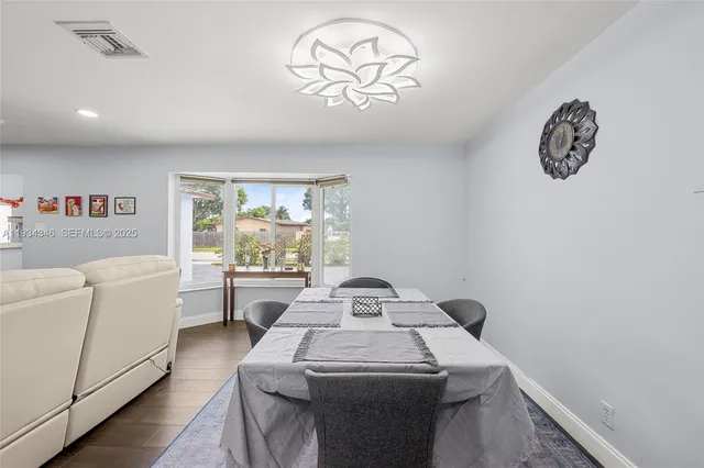 a view of a dining room with furniture window and outside view