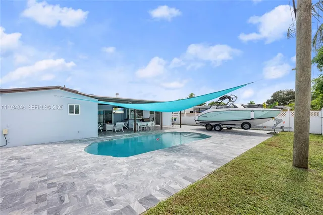 a view of a swimming pool with chairs