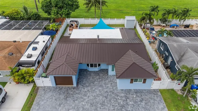 an aerial view of residential houses with outdoor space