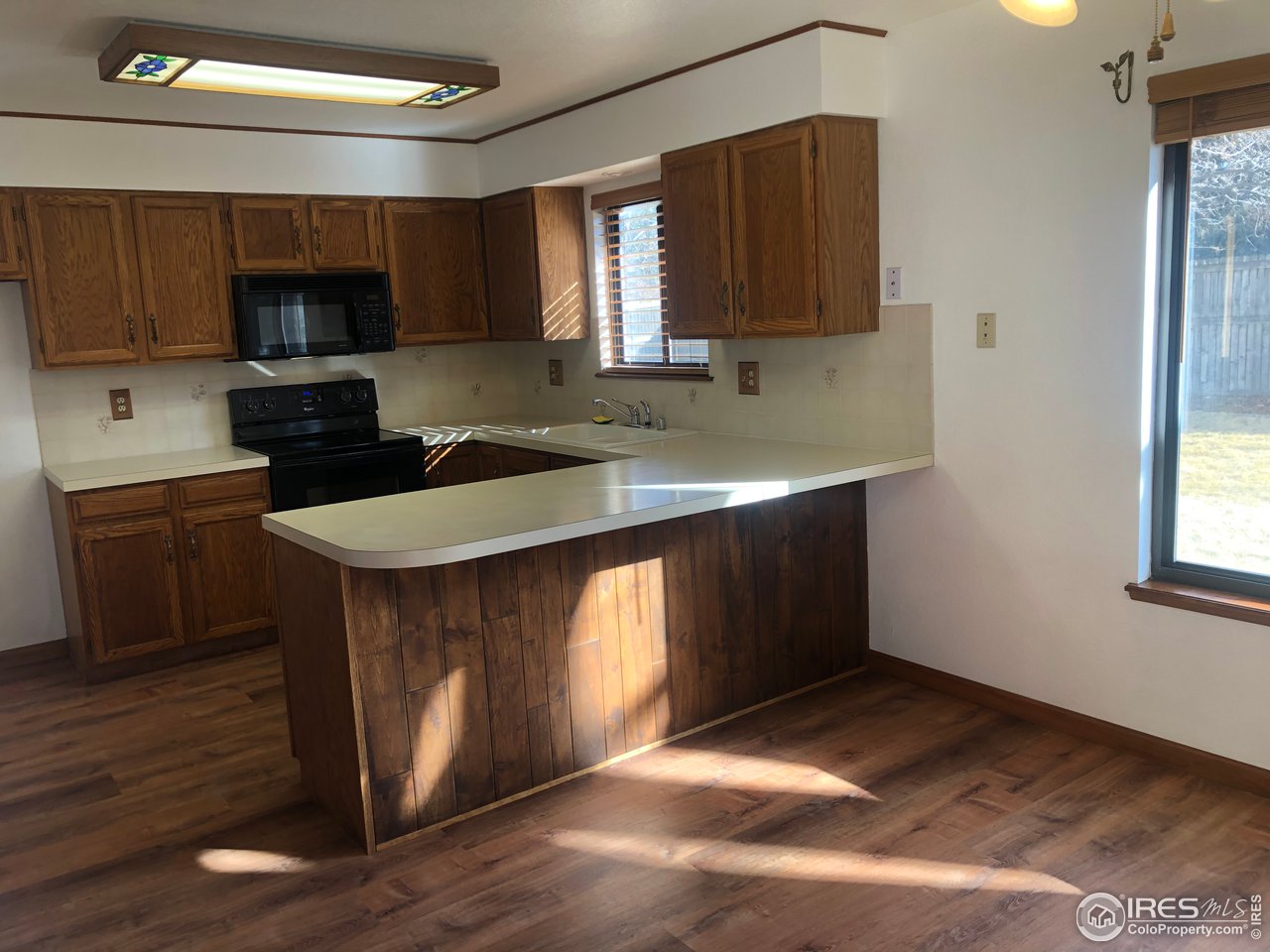 4702 9th St Road Greeley, CO 80634 - Photo 5 of 18 Open Kitchen with Plenty of Cabinets & Counter Space
