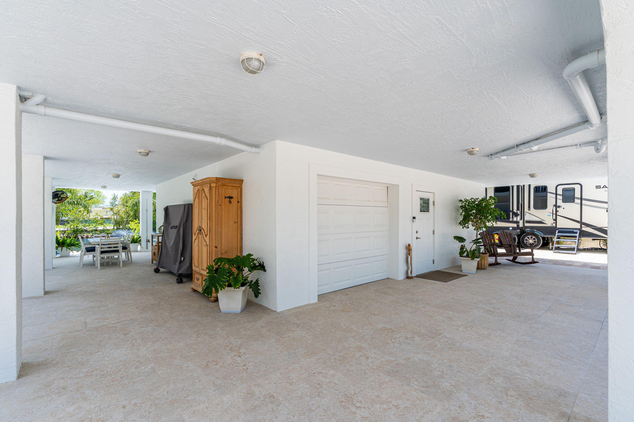 24 Mutiny Place Key Largo, FL 33037 - Photo 40 of 69 a view of a livingroom with furniture and a garage