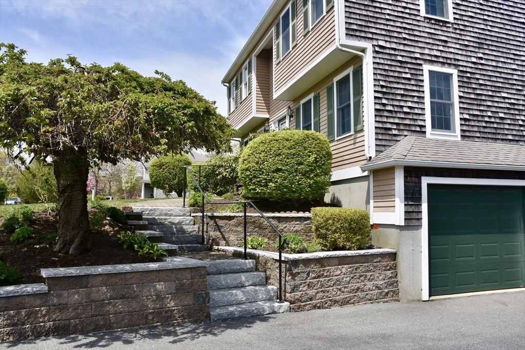 6 Oakbluff Road Bourne, MA 02562 - Photo 11 of 36 a front view of a house with a garden