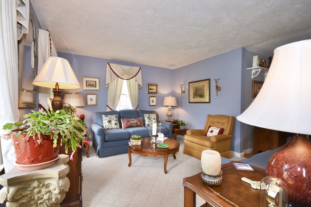 6 Oakbluff Road Bourne, MA 02562 - Photo 16 of 36 a living room with furniture a table and a potted plant