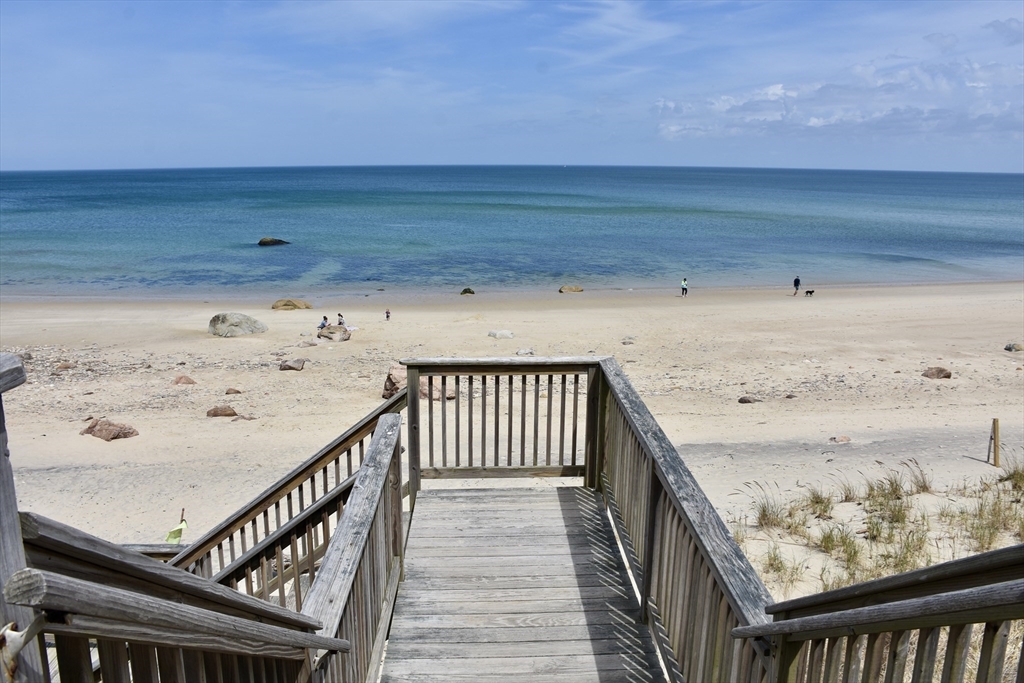 6 Oakbluff Road Bourne, MA 02562 - Photo 2 of 36 a view of a balcony with wooden floor