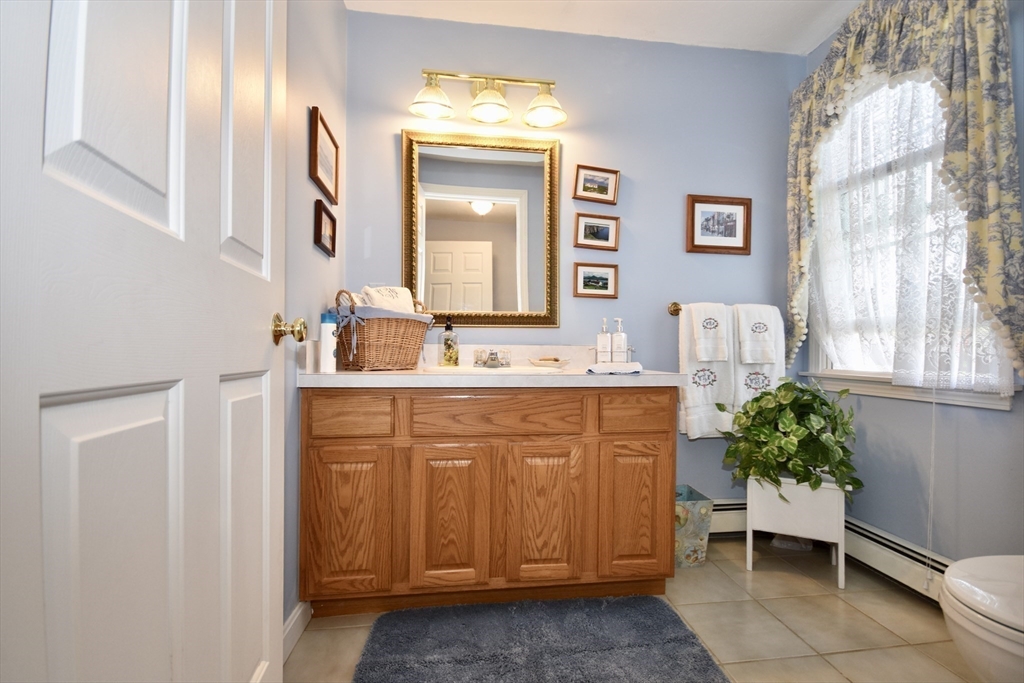 6 Oakbluff Road Bourne, MA 02562 - Photo 24 of 36 a bathroom with a sink and a mirror
