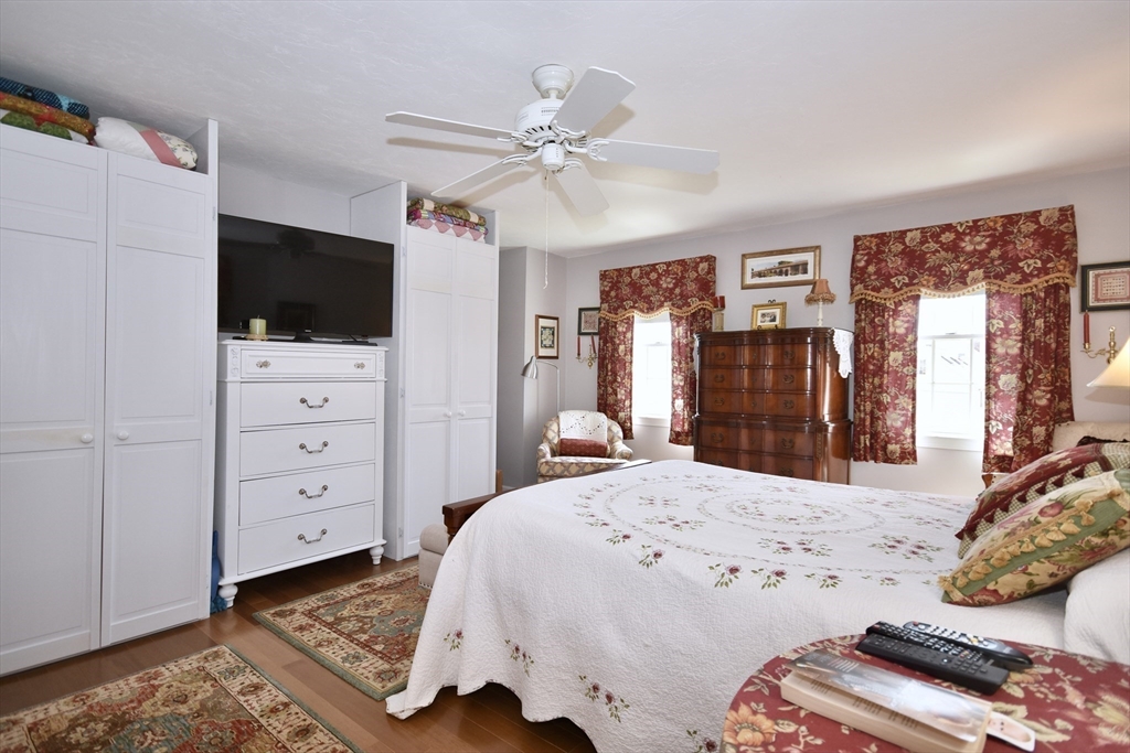 6 Oakbluff Road Bourne, MA 02562 - Photo 26 of 36 a bedroom with a bed and a flat screen tv