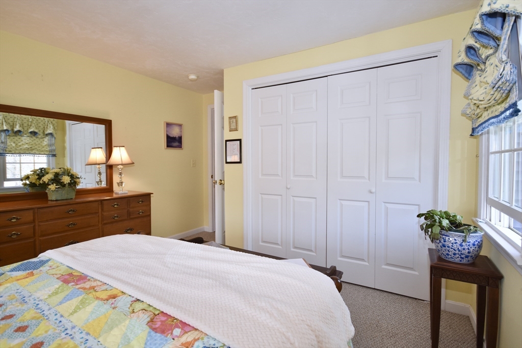6 Oakbluff Road Bourne, MA 02562 - Photo 31 of 36 a bedroom with a bed potted plant and a dresser