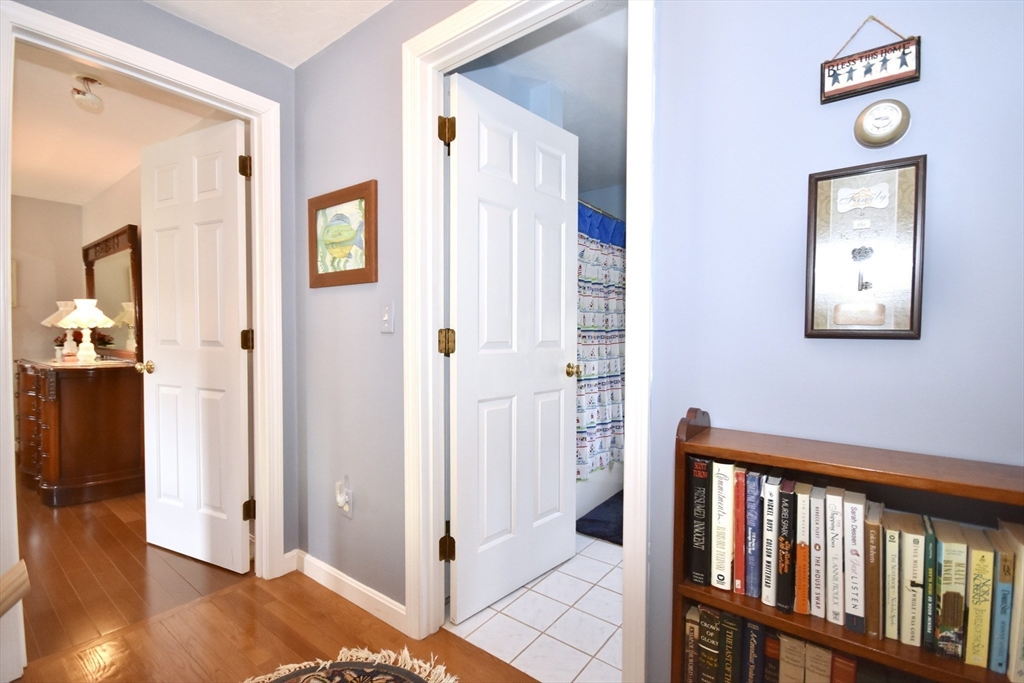 6 Oakbluff Road Bourne, MA 02562 - Photo 32 of 36 a view of a hallway with wooden floor and a bathroom