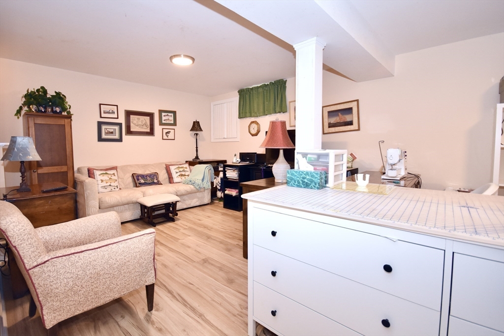 6 Oakbluff Road Bourne, MA 02562 - Photo 35 of 36 a living room with furniture and wooden floor
