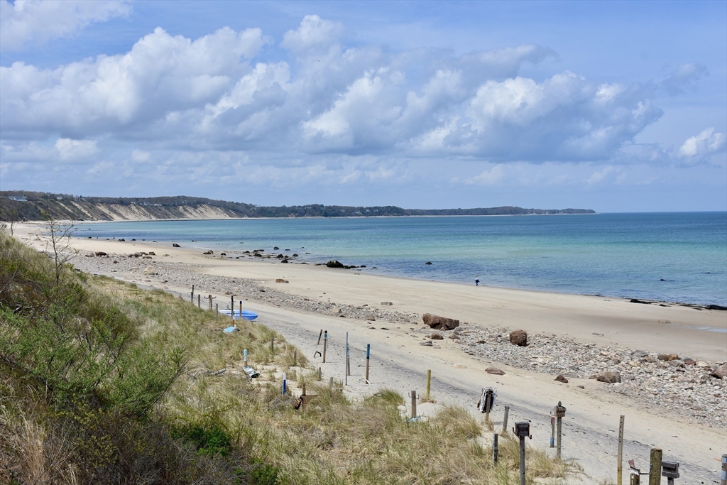 6 Oakbluff Road Bourne, MA 02562 - Photo 4 of 36 a view of a beach with a yard