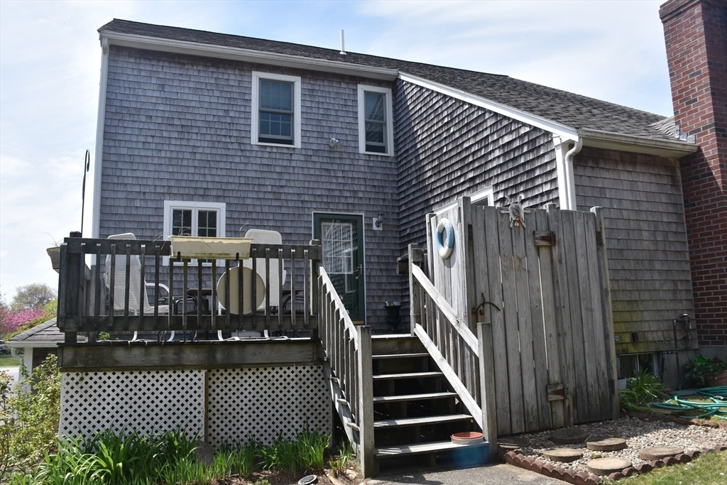 6 Oakbluff Road Bourne, MA 02562 - Photo 8 of 36 a view of a house with wooden deck front door