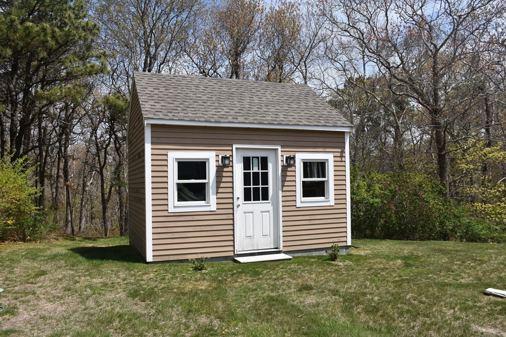 6 Oakbluff Road Bourne, MA 02562 - Photo 10 of 36 a view of a house with a yard