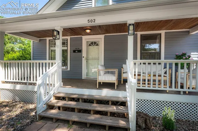 a view of a balcony with furniture