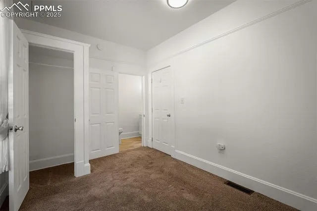 an empty room with a bench