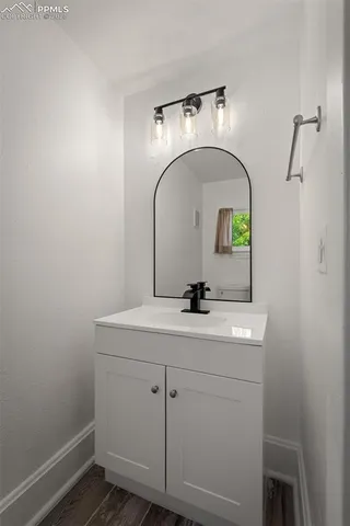 a bathroom with a sink and mirror