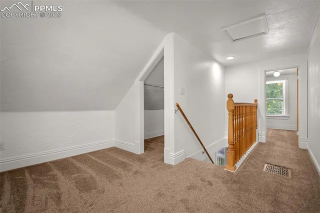 a view of a hallway with staircase
