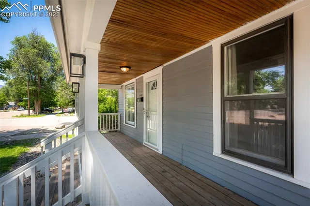 a porch with wooden floor