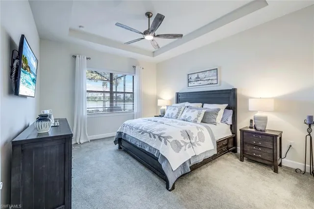 a spacious bedroom with a bed and a desk