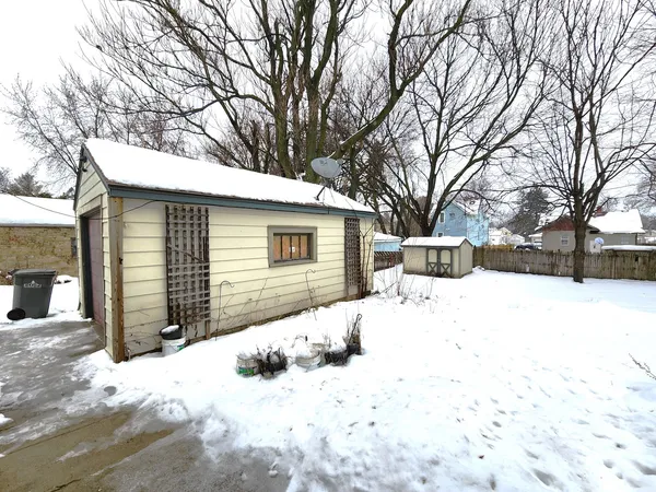 a view of a house with a yard and trees