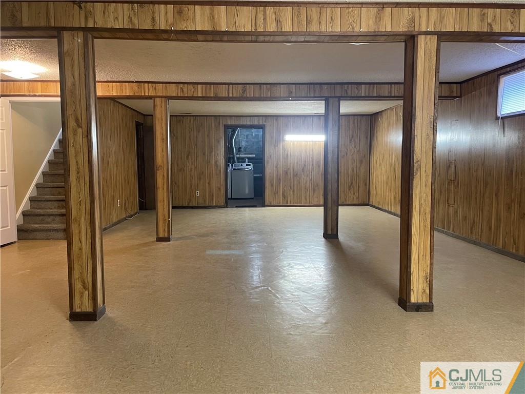 93 C Woodbridge Terrace, Unit 9303 Woodbridge, NJ 07095 - Photo 12 of 14 a view of a hallway with wooden floor