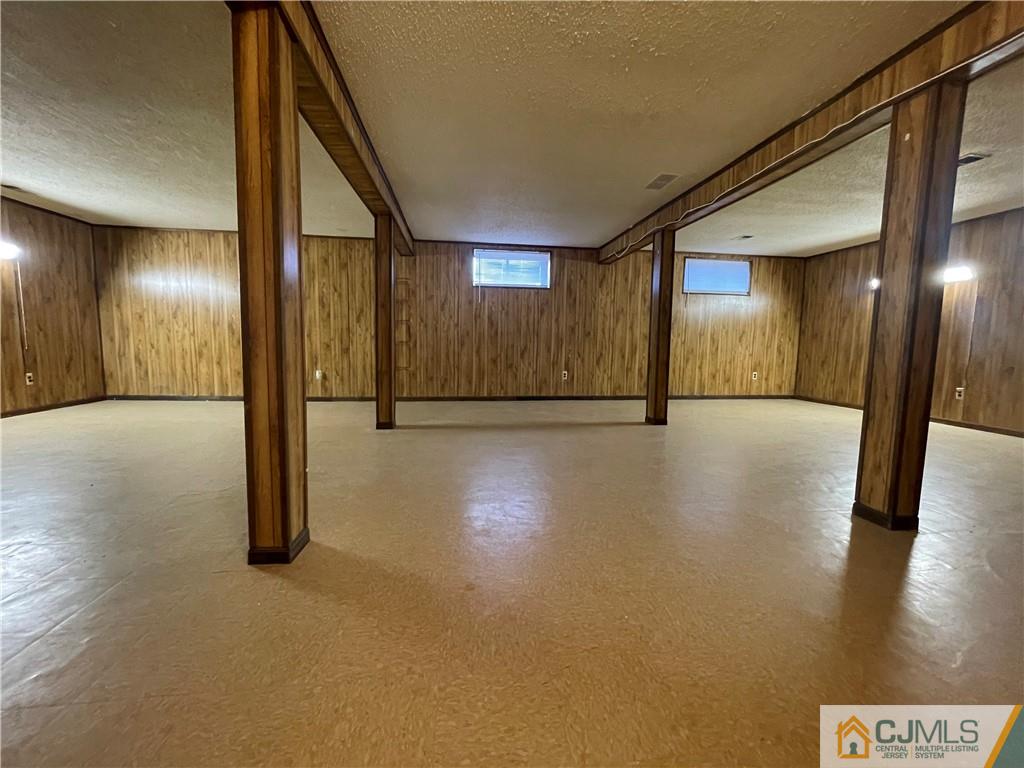 93 C Woodbridge Terrace, Unit 9303 Woodbridge, NJ 07095 - Photo 14 of 14 a view of a hallway with wooden floor