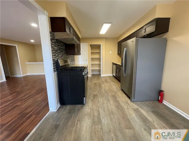 a view of a kitchen from the hallway