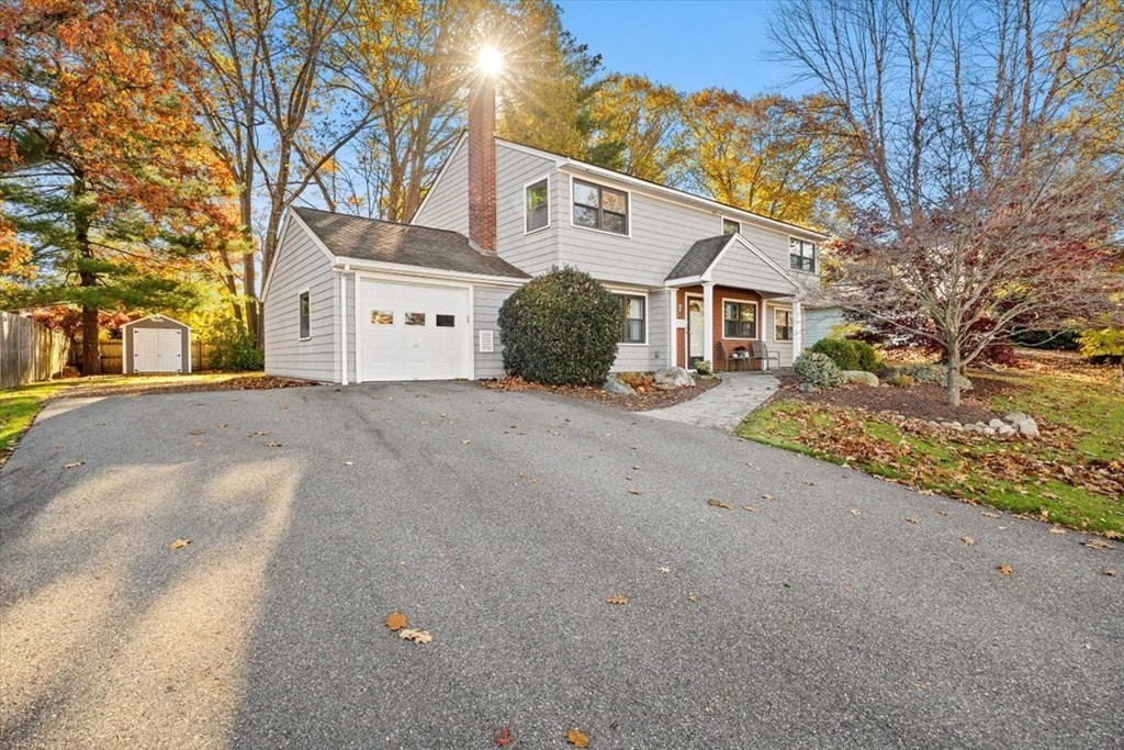 7 Irving Road Natick, MA 01760 - Photo 1 of 39 a front view of a house with a yard and garage