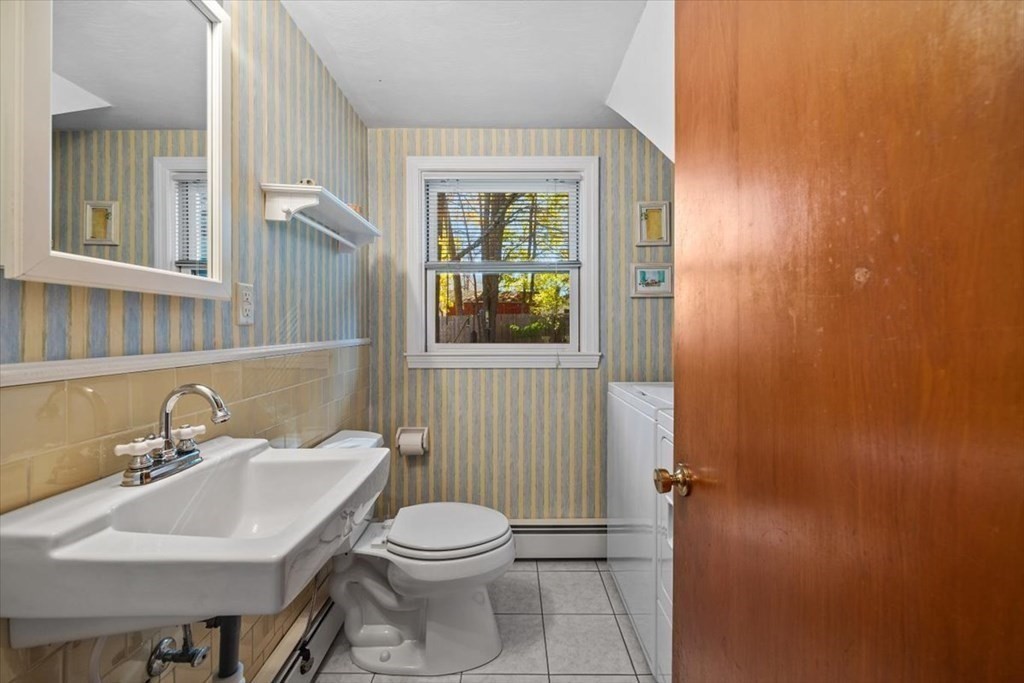 7 Irving Road Natick, MA 01760 - Photo 19 of 39 a bathroom with a sink a toilet and mirror