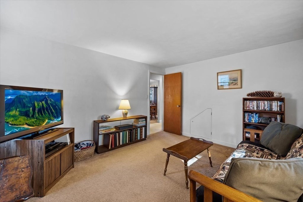 7 Irving Road Natick, MA 01760 - Photo 21 of 39 a living room with furniture and a flat screen tv