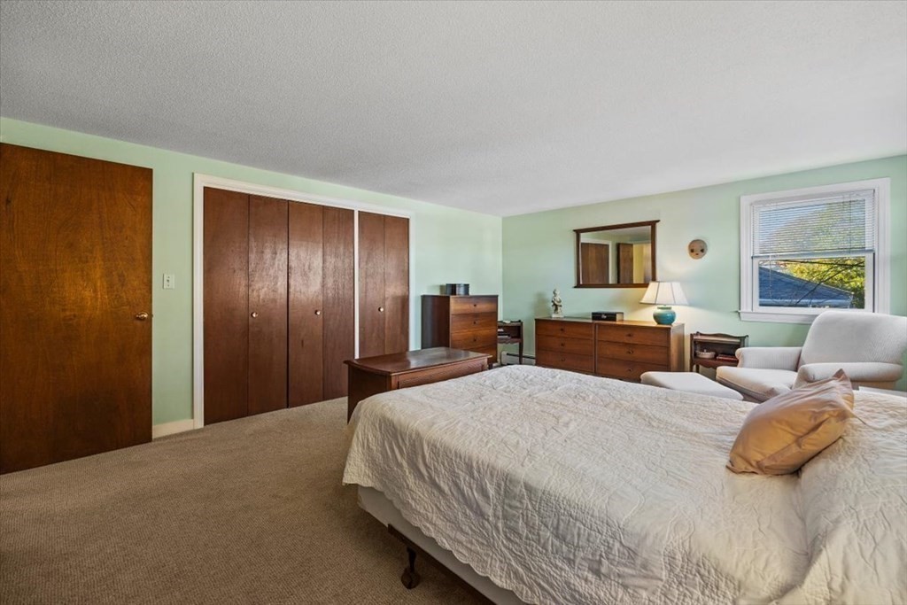 7 Irving Road Natick, MA 01760 - Photo 27 of 39 a spacious bedroom with a bed and furniture