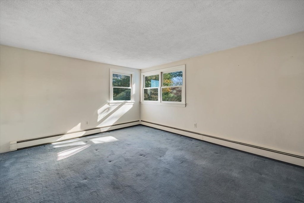 7 Irving Road Natick, MA 01760 - Photo 30 of 39 an empty room with a window