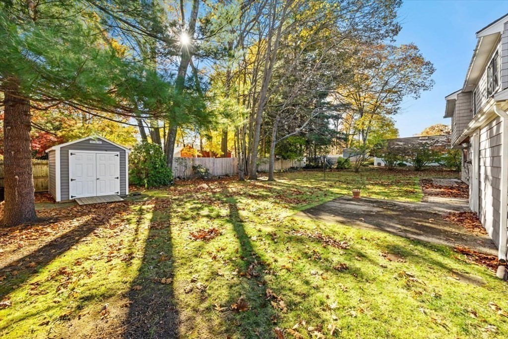 7 Irving Road Natick, MA 01760 - Photo 35 of 39 a view of a yard with a house and trees in the background