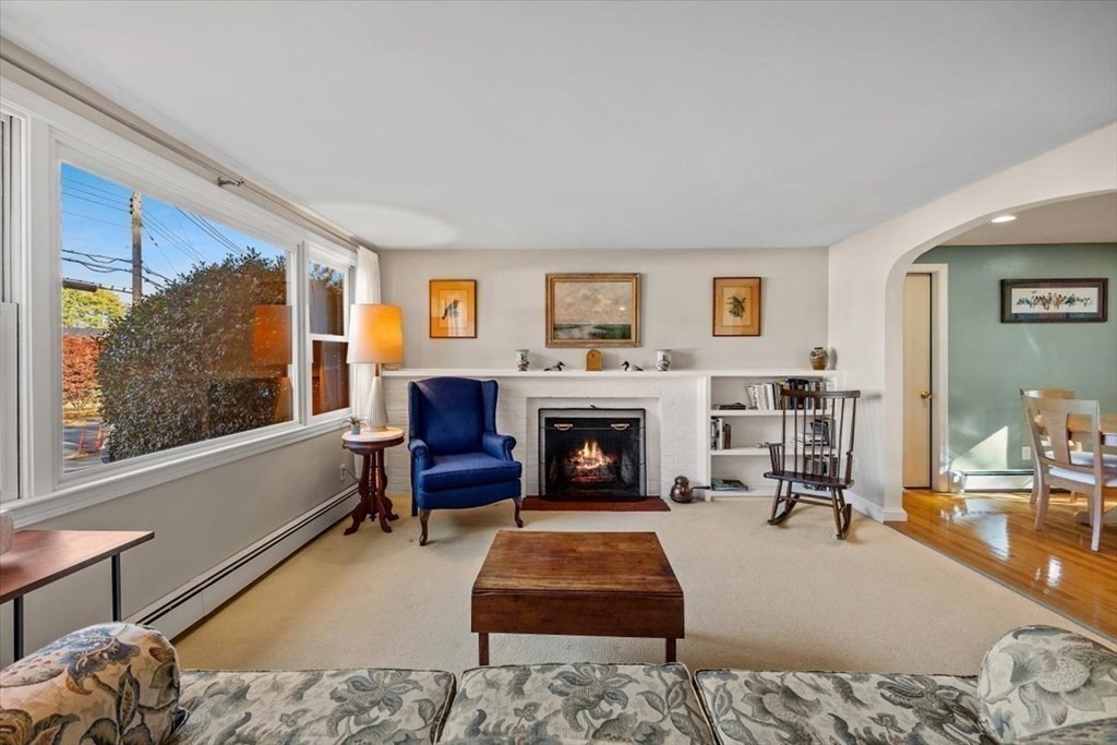 7 Irving Road Natick, MA 01760 - Photo 5 of 39 a living room with furniture a rug and a fireplace