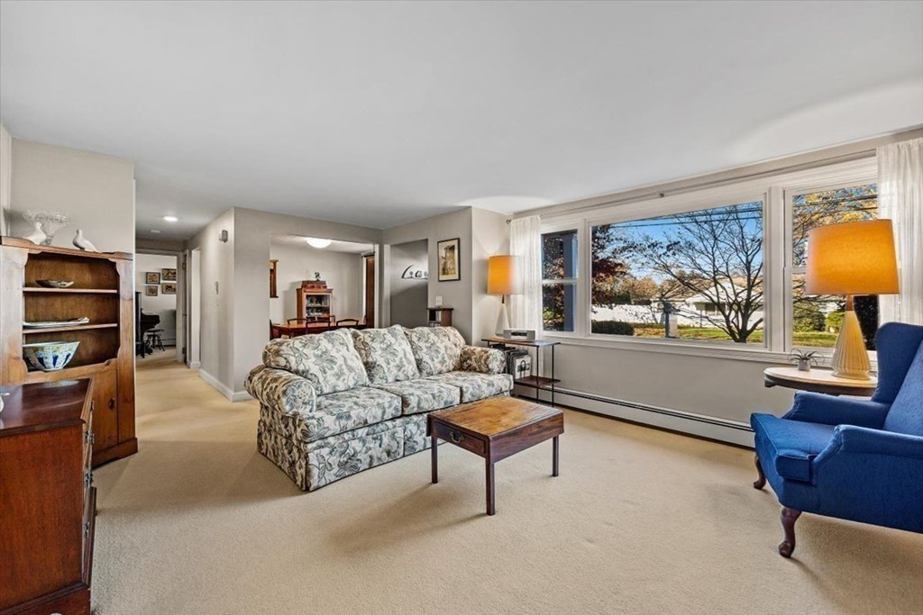 7 Irving Road Natick, MA 01760 - Photo 7 of 39 a living room with furniture and a flat screen tv